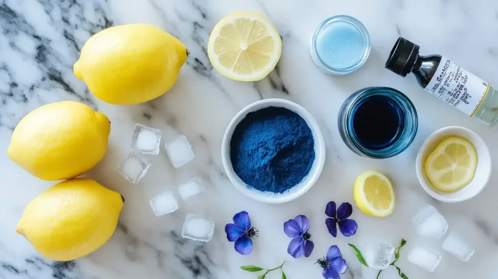 How Can I Make My Lemonade Blue? 5 Easy and Fun Tips 5 Ingredients for making blue lemonade, including lemons, blue spirulina, butterfly pea flowers, and sugar, arranged on a countertop.How Can I Make My Lemonade Blue?