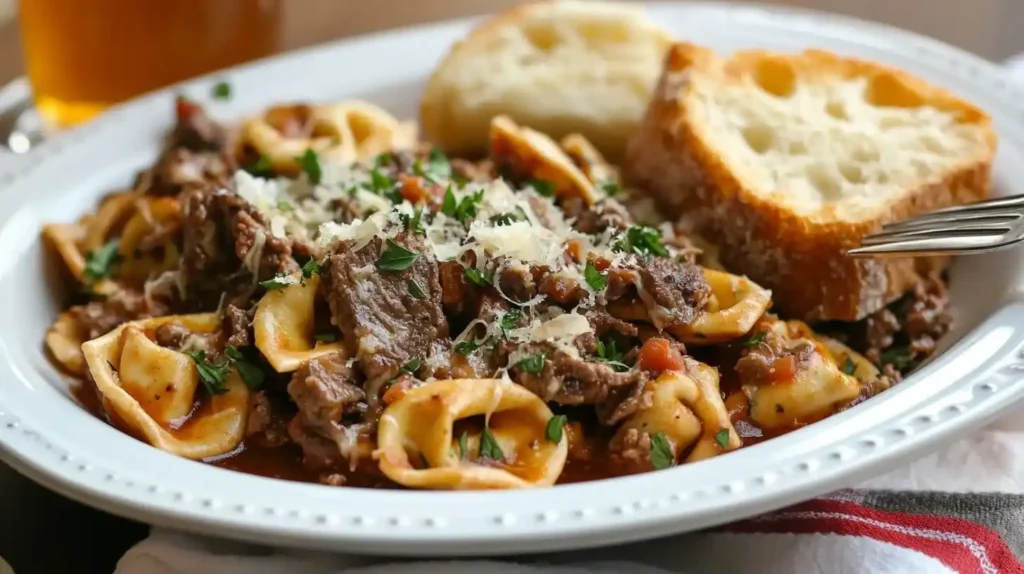 Philly Cheesesteak Tortellini: A Fusion Recipe to Savor 6 A plate of Philly Cheesesteak Tortellini, garnished with parsley and served with crispy garlic bread.