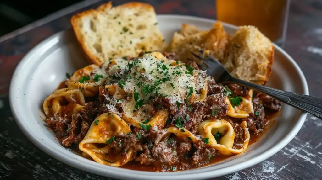 Philly Cheesesteak Tortellini: A Fusion Recipe to Savor 2 What Is Philly Cheesesteak Tortellini. garnished with parsley and served with crispy garlic bread.