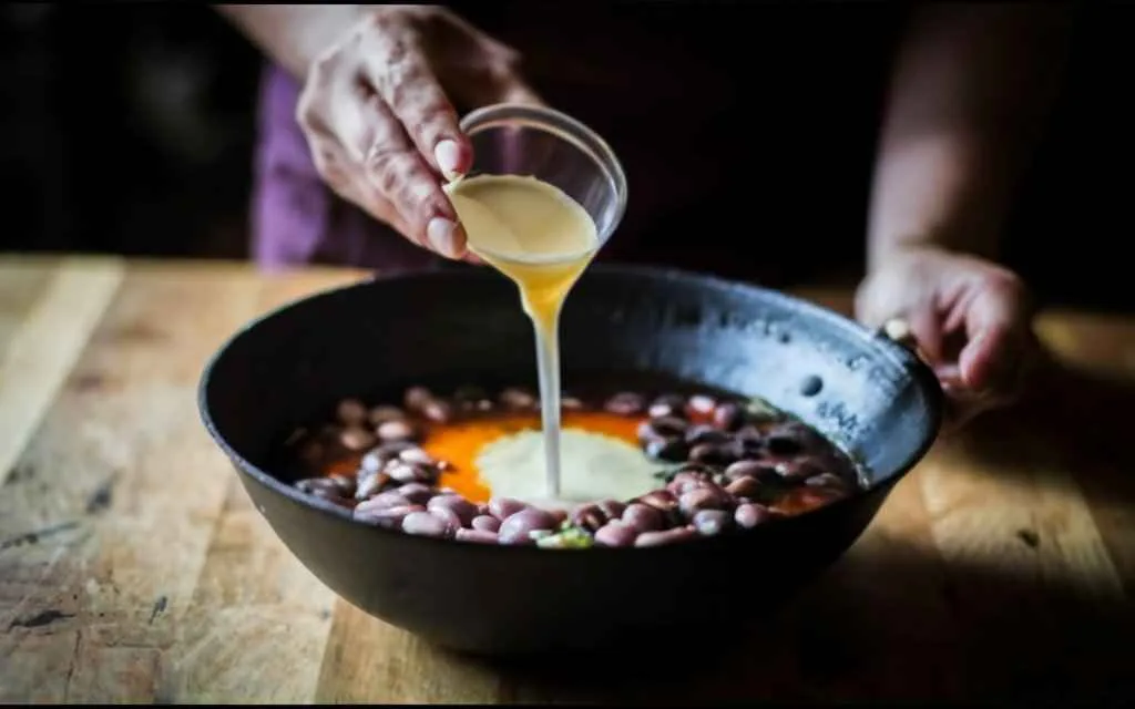 What Makes Bean Soup Thicker? Expert Tips And Tricks 4 Cornstarch Slurry Being Added To Bean Soup.What makes bean soup thicker?