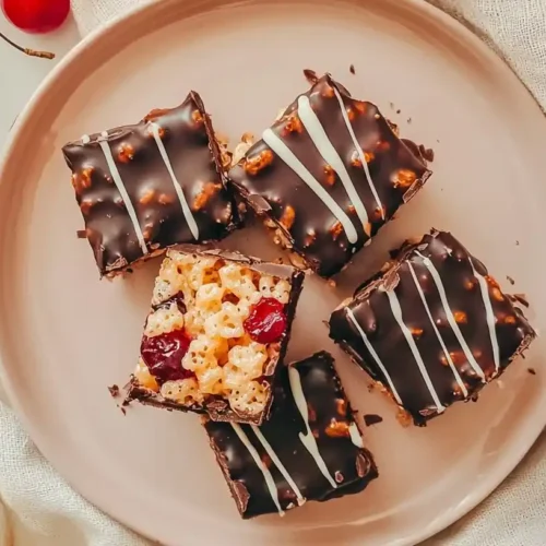 Chocolate Covered Cherry Rice Krispies Treat: Sweet Valentine Indulgence 3 chocolate covered cherry rice krispies treat photo10 with maraschino cherries on a pink platter with Valentine decorations