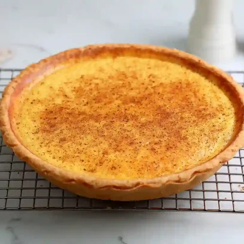 Finished Egg Custard Pie Recipe cooling on rack