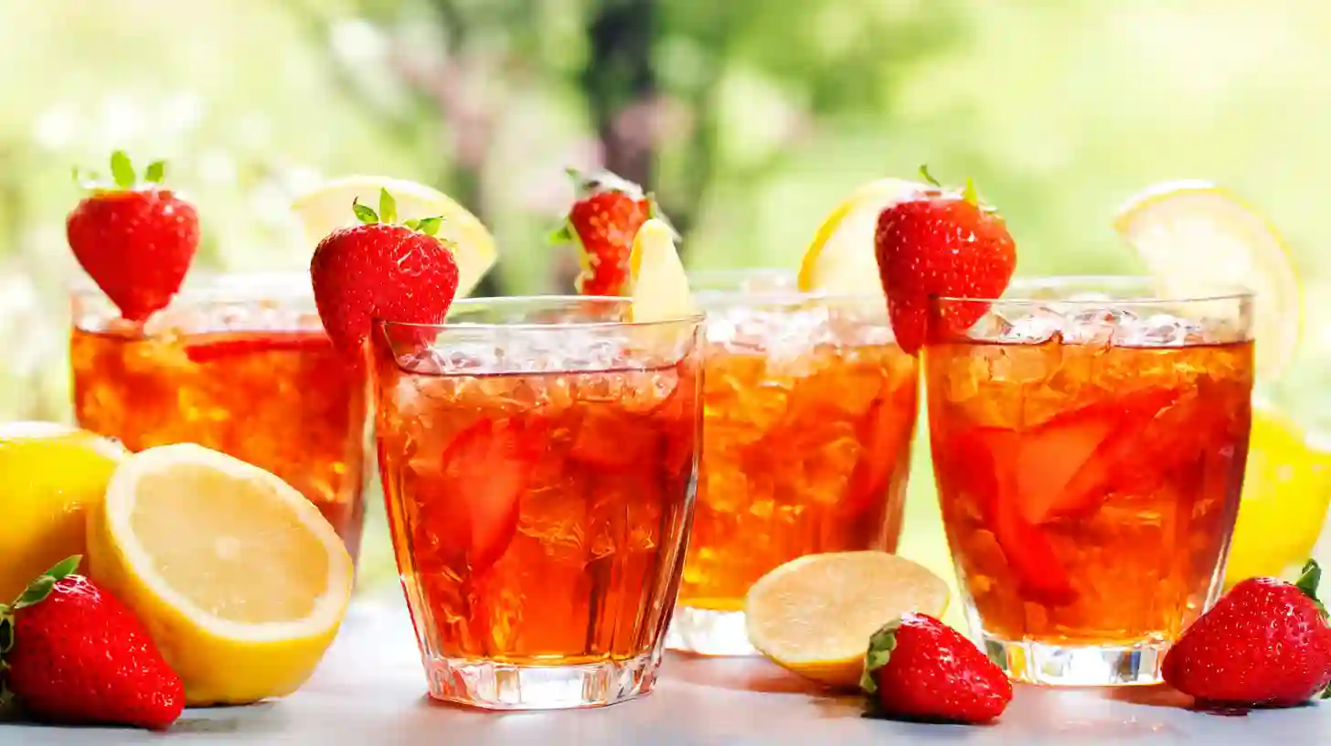 Southern Strawberry Sweet Tea Served Iced Southern strawberry sweet tea with garnishes